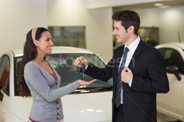 Smiling businessman giving car key to happy customer Stock photo © wavebreak_media