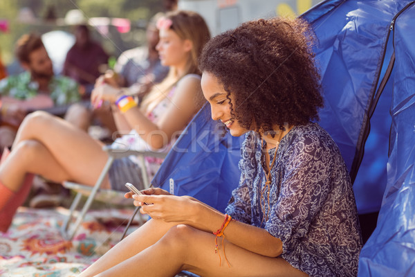 Carefree hipster sending text message Stock photo © wavebreak_media
