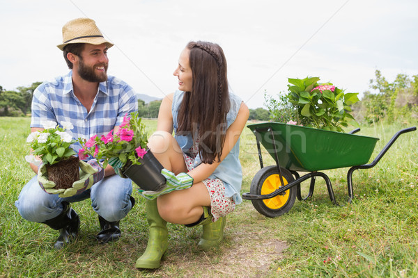 Happy young couple gardening together Stock photo © wavebreak_media