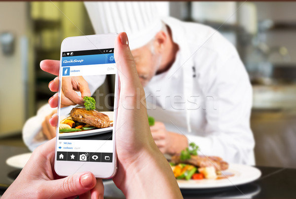 Composite image of hand holding smartphone Stock photo © wavebreak_media