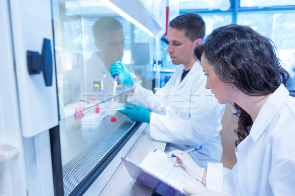 Science students using pipette in the lab Stock photo © wavebreak_media