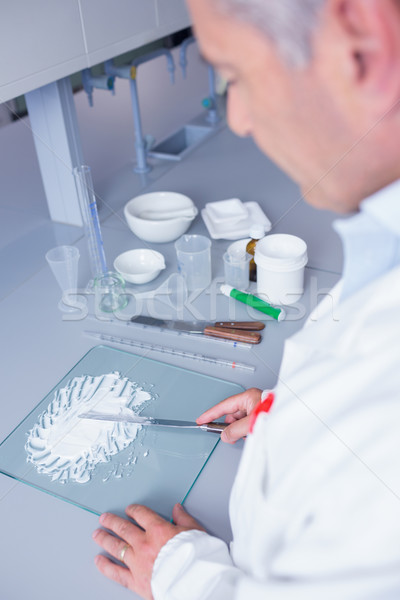 Biochemist standing while preparing some medicine Stock photo © wavebreak_media