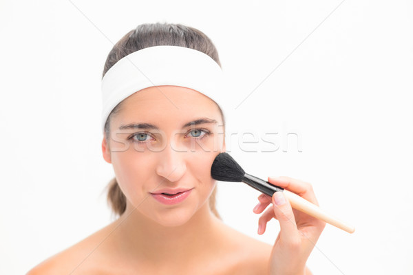 Hand applying blush to beautiful woman Stock photo © wavebreak_media