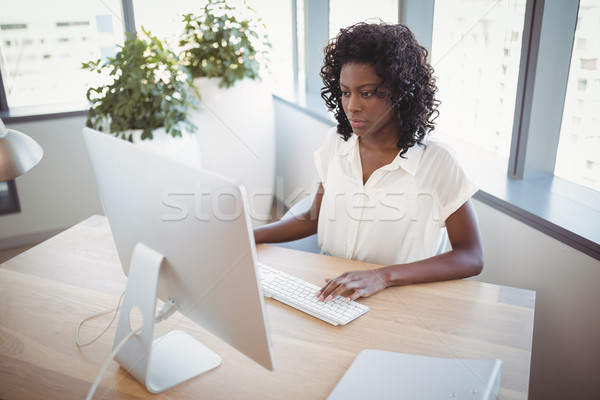 Attentive executive working at desk Stock photo © wavebreak_media