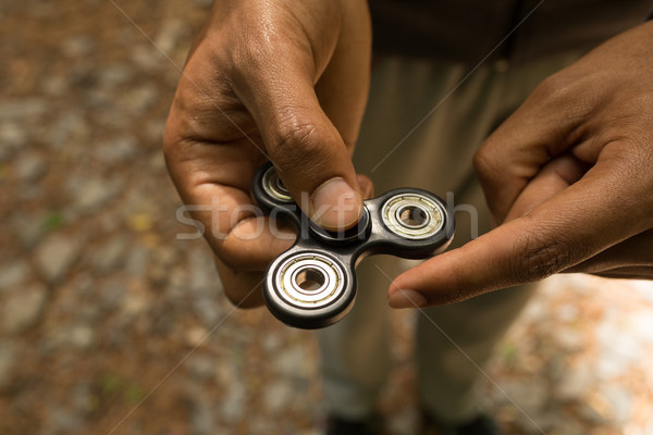 Man holding a fidget spinner Stock photo © wavebreak_media