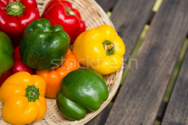 Stock photo: Fresh bell peppers in wicker basket