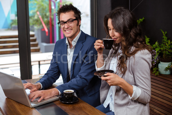 Stockfoto: Zakenlieden · werken · laptop · koffie · coffeeshop · zakenman