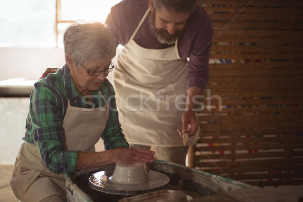 Male potter assisting female potter Stock photo © wavebreak_media