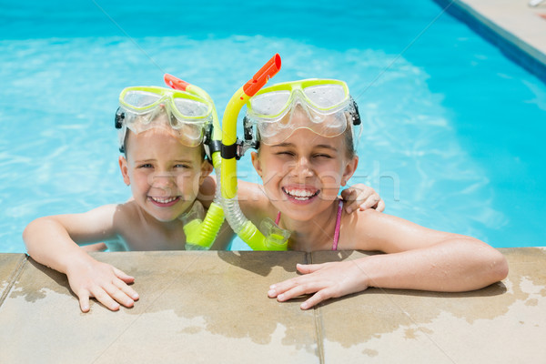 Lächelnd Junge Mädchen entspannenden Seite Schwimmbad Stock foto © wavebreak_media