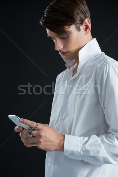 Androgynous man using mobile phone Stock photo © wavebreak_media