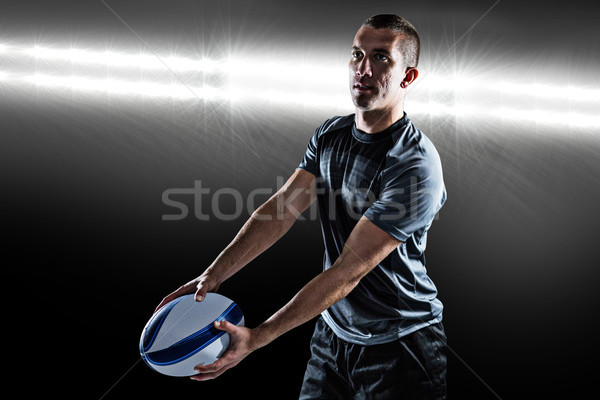Composite image of focused rugby player looking away while holdi Stock photo © wavebreak_media
