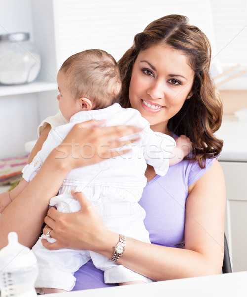 Young mother taking care of her adorable baby Stock photo © wavebreak_media
