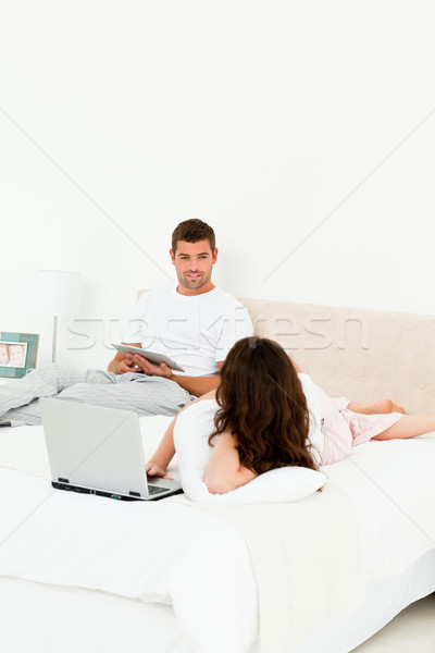Pár együtt dolgozni ágy hétvége otthon nő Stock fotó © wavebreak_media