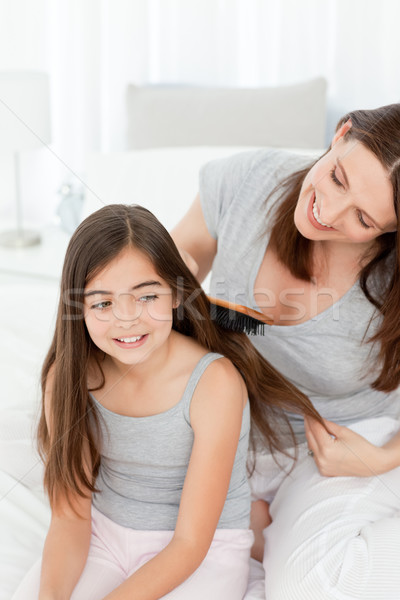 Femme fille cheveux maison famille sourire [[stock_photo]] © wavebreak_media