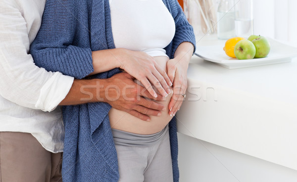 Couple hugging in the kitchen at home Stock photo © wavebreak_media