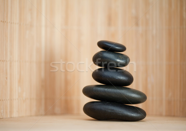 Several piled up pebbles on a brown background Stock photo © wavebreak_media