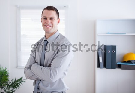 Smiling business woman giving her hand while looking at the camera Stock photo © wavebreak_media