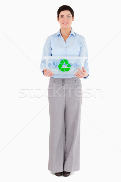 Businesswoman showing a recycling box against a white background Stock photo © wavebreak_media