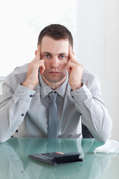 Young businessman disappointed with his calculation Stock photo © wavebreak_media