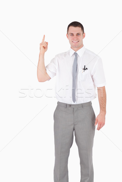 Portrait employé de bureau pointant quelque chose blanche sourire [[stock_photo]] © wavebreak_media