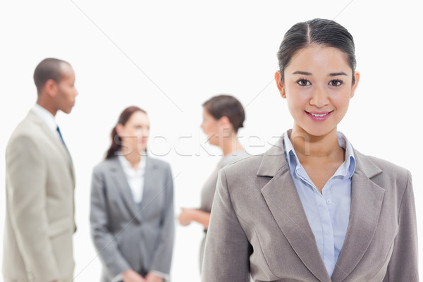 Close-up of a businesswoman smiling with co-workers in the background Stock photo © wavebreak_media