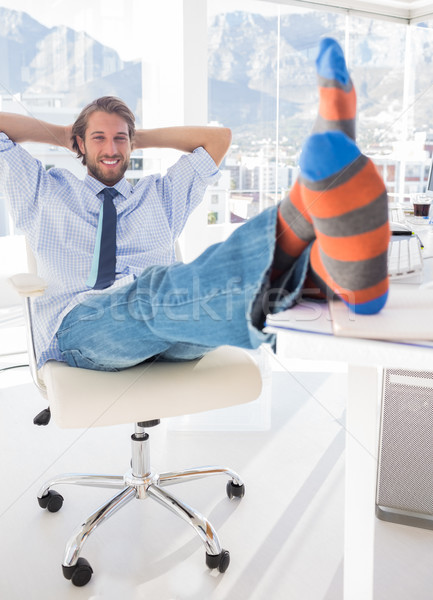 Shoeless designer kicking back Stock photo © wavebreak_media