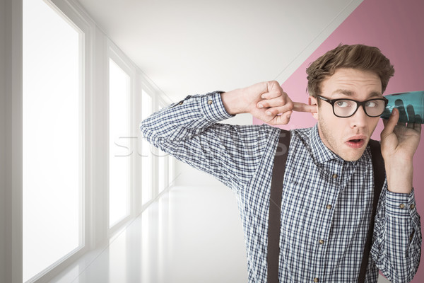 Composite image of geeky businessman eavesdropping with cup Stock photo © wavebreak_media