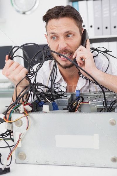Angry computer engineer making a call Stock photo © wavebreak_media