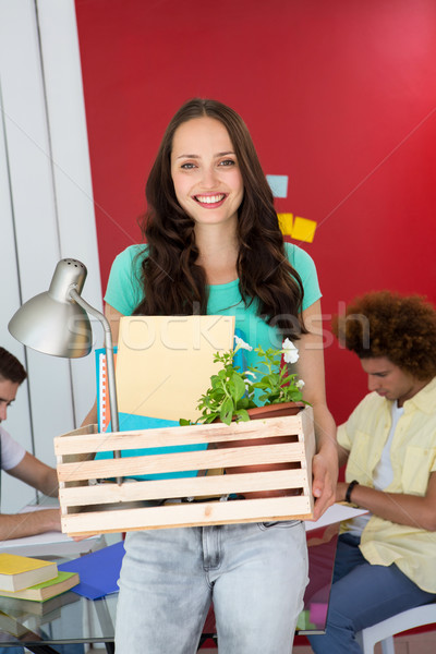 Casual businesswoman carrying her belongings in box Stock photo © wavebreak_media