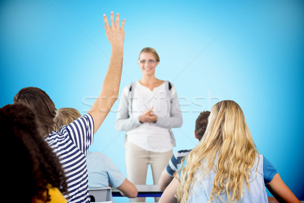 Stock photo: Composite image of student raising hand in classroom
