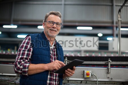 Serious technician using digital cable analyzer on server Stock photo © wavebreak_media