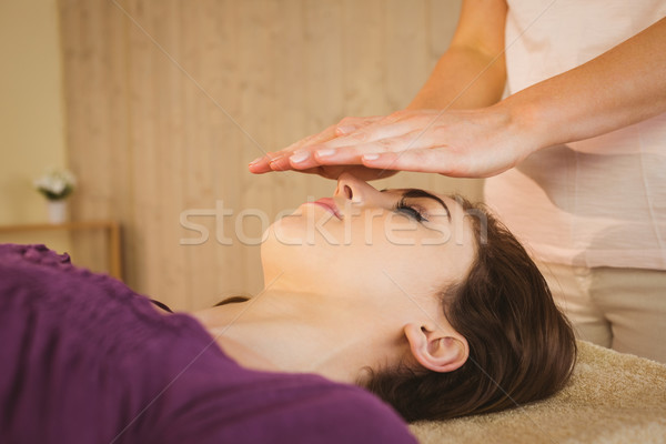 Young woman having a reiki treatment Stock photo © wavebreak_media
