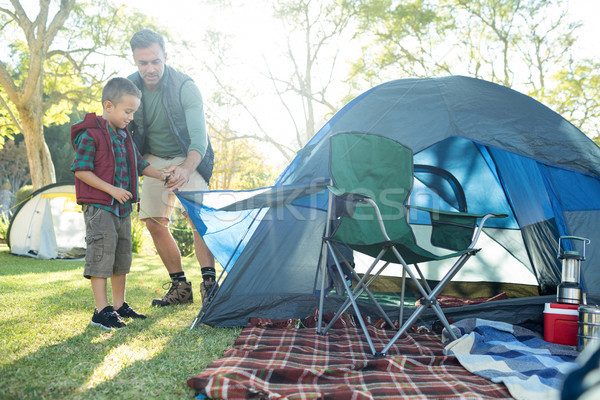 Father and son setting up the tent at campsite Stock photo © wavebreak_media