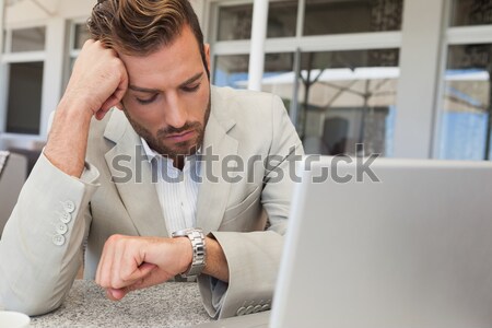 Businessman with head in hand in restaurant Stock photo © wavebreak_media