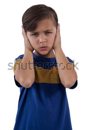 Cute boy covering his ears against white background Stock photo © wavebreak_media