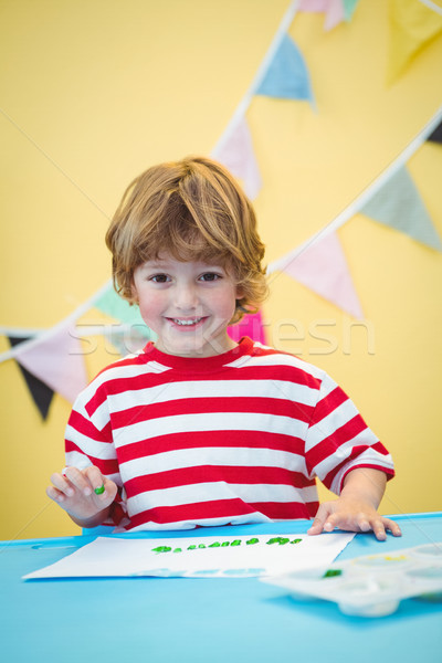 Smiling boy finger painting Stock photo © wavebreak_media
