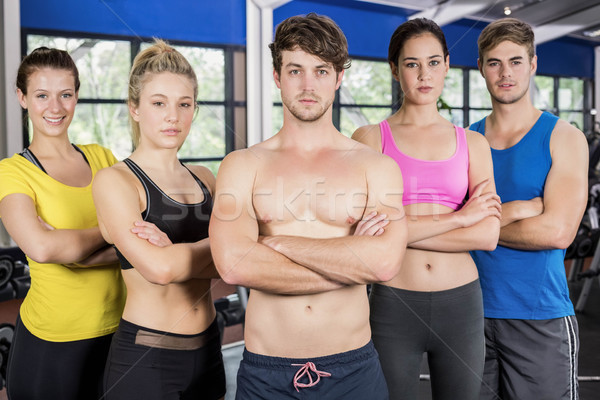 Athletic men and women posing with arms crossed Stock photo © wavebreak_media