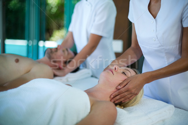 Woman receiving a face massage from masseur  Stock photo © wavebreak_media