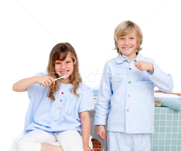 Smiling brother and siter brushing their teeth  Stock photo © wavebreak_media