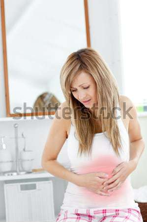 Cute woman having a stomachache in the bathroom at home Stock photo © wavebreak_media