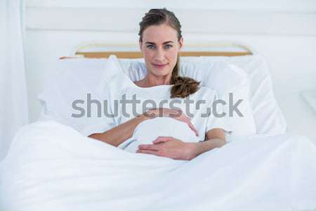 Serene mother sleeping peacfully on the bed in the morning Stock photo © wavebreak_media