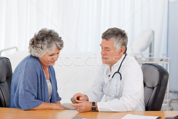 A senior doctor with his patient in his office Stock photo © wavebreak_media