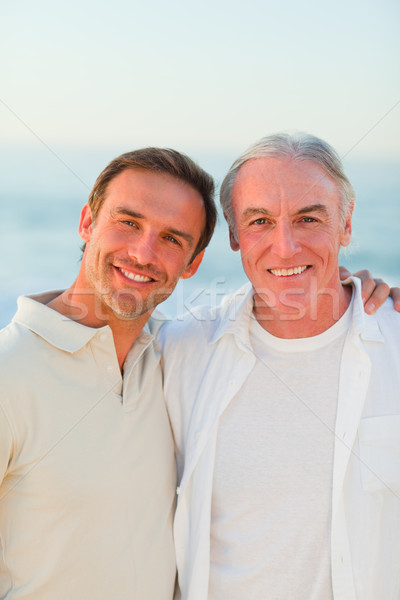 Stockfoto: Vader · zoon · strand · familie · zonsondergang · zee · oceaan