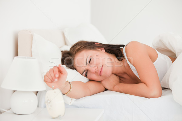 Beautiful woman waking up against a white background Stock photo © wavebreak_media