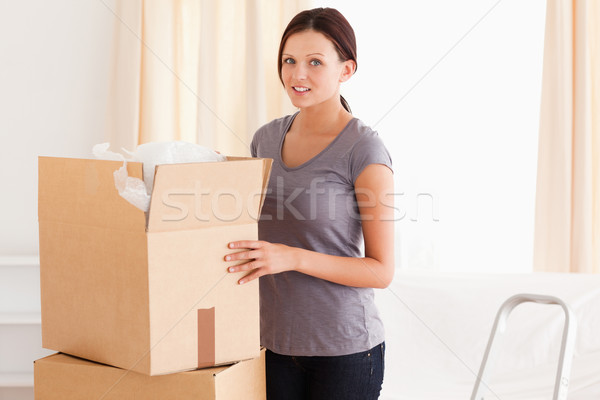 A pretty woman with a cardboard Stock photo © wavebreak_media