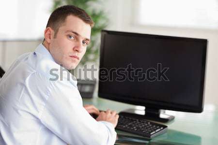 Shadowing a smiling young businessman Stock photo © wavebreak_media