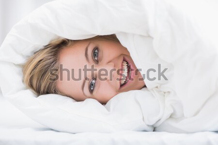 ストックフォト: 疲れ · 女性 · 耳 · 目覚まし時計 · ベッド · ホーム