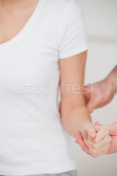 Woman sitting while being massaged in a room Stock photo © wavebreak_media