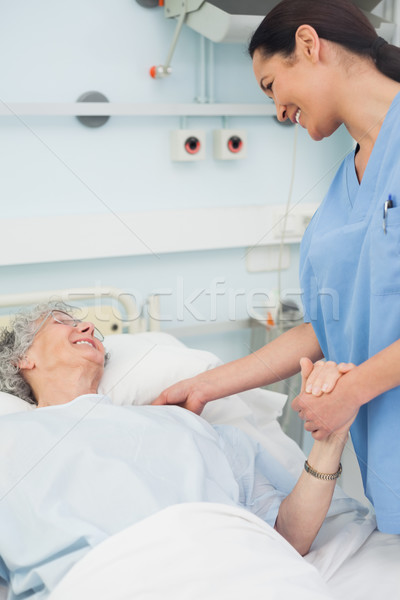 Nurse and a patient smiling in hospital ward Stock photo © wavebreak_media