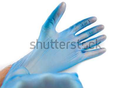 Homme bleu jetable gants en caoutchouc mains protection [[stock_photo]] © wavebreak_media